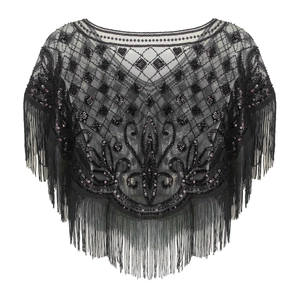 Detail of vintage black mesh shawl with sequined patterns and long tassel fringe trim