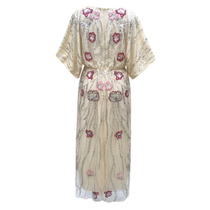 Detail view of the beige 1920s vintage dress with silver sequins and floral embroidery