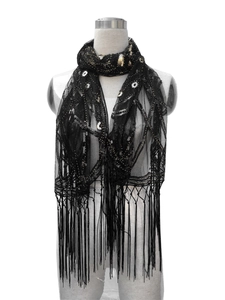Detail of vintage 1920s black mesh shawl with gold sequins and beaded fringe accents