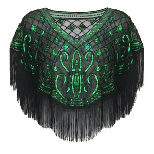 Detail of green sequin embroidery and black fringe tassels on a vintage mesh shawl