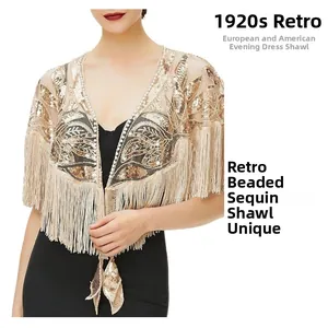 Detailed view of 1920s vintage champagne shawl with gold sequins and fringe