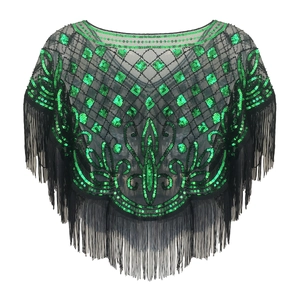 Detail of vintage emerald green sequins and black fringe tassels on sheer mesh capelet