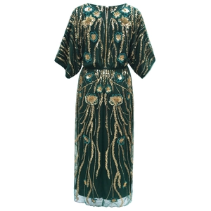 Detail showing intricate gold sequin floral embroidery on dark green evening dress mesh