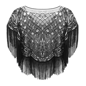 Close-up of vintage black sequined capelet with geometric patterns and fringe