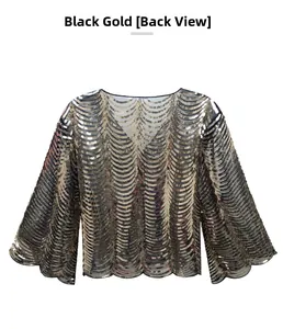 Detail of black gold sequin capelet showing intricate fish scale pattern from back view