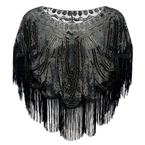 Detail of vintage 1920s black shawl featuring intricate sequins and dangling fringe