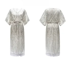 Front and back view of 1920s vintage white V-neck evening dress with silver sequins