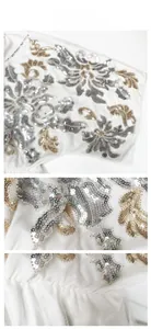 Detailed view of silver and gold sequin floral embroidery on a white mesh dress
