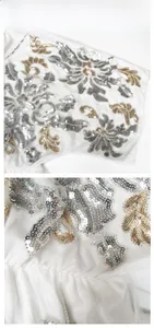 Detail showing high-quality silver and gold sequin floral embroidery on white mesh fabric