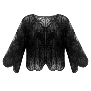 Détail du châle en mesh à paillettes noires avec bords festonnés et broderie rétro