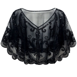 Detail of vintage black mesh shawl with intricate embroidery and sparkling sequins