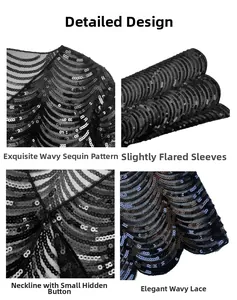 Detail of black mesh lace shawl with sequins, wavy embroidery and bell sleeves
