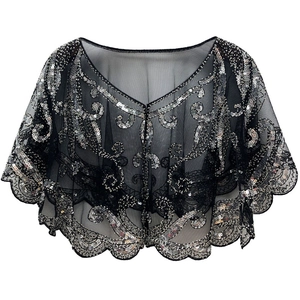 Close-up of black mesh capelet with silver sequins and wavy hem in 1920s Gatsby style