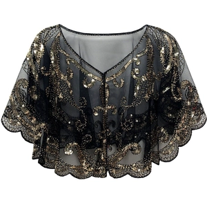 Detail of 1920s vintage capelet with gold sequin embroidery on black mesh fabric