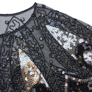 Retro 1920s shawl with intricate silver sequins and beads on black mesh fabric