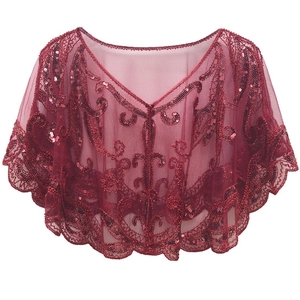 Detailed close-up of wine red sequined lace cape with elegant vine embroidery patterns