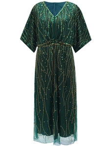 Vintage 1920s evening dress with heavy beadwork and emerald green sequins fringe detail