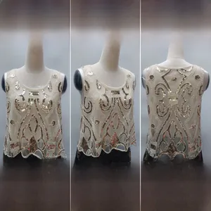 Detail of 1920s vintage style flapper top with gold sequins and beaded wave patterns