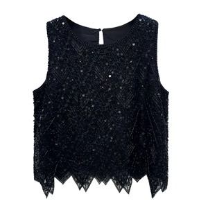 Luxurious black sleeveless top with heavy sequin V-pattern beadwork and sawtooth hem