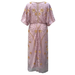 Macro shot of luxury lavender gown with intricate gold and pink sequin floral embroidery