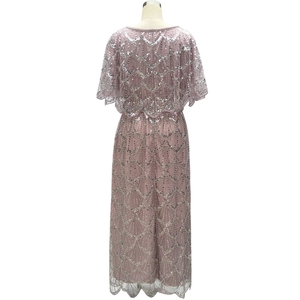 Detail of beaded sequins and wave pattern on pink tulle evening cape dress