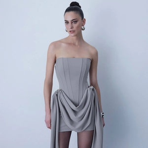 Elegant grey strapless bodycon dress featuring corset boning and side metal buckles