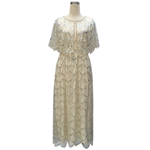 Elegant sequined dress with matching shawl in apricot featuring mesh diamond patterns