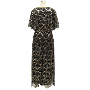 Detailed close-up of sequin embroidery with geometric wave patterns on a black dress