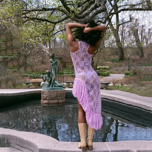 Lavender lace sleeveless dress with asymmetric ruffled hem and sheer see-through texture