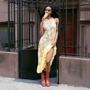 Yellow lace sleeveless see-through maxi dress with ruffled hem and vintage boots