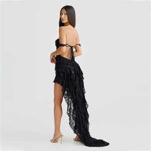 Detailed view of black lace high-low dress with layered ruffles and back tie design