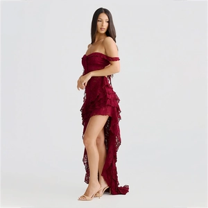 Macro detail of wine red lace texture with elegant layered ruffles on a strapless dress