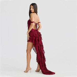 Detail of burgundy lace dress featuring backless lace-up design and asymmetric hem