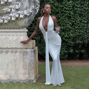 Macro detail of elegant white halter neck dress with sophisticated side ruching effects