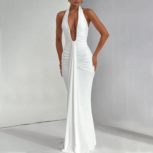 Detail of elegant white halter neck maxi dress with deep V-neck and draped pleats