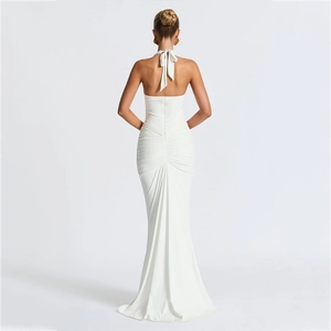 Elegant white backless halter maxi dress with ruched details and a mermaid silhouette