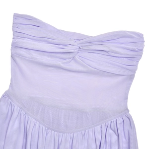 Close-up of lavender mesh dress featuring a twisted knot neckline and pleated fabric details