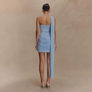 Detail view of the back pleats and ruched texture on a light blue bodycon mini dress