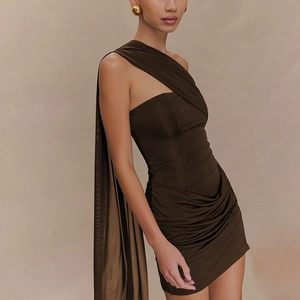 Detail of chocolate brown off-shoulder mini dress featuring draped sash and pleated texture