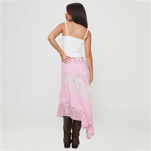 Pink patchwork irregular midi skirt with floral patterns and polka dots shown from the back