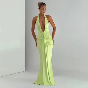 Detail of lime green halter maxi dress with deep V-neck and elegant front pleats