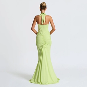 Detail of ruched texture and halter back design on this lime green maxi dress
