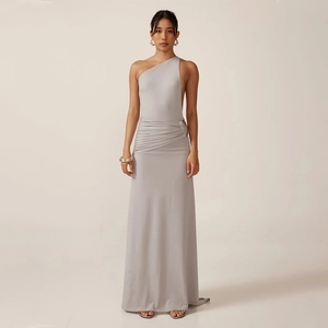 Detail of waist pleats on an elegant silver one-shoulder slim fit maxi dress for women