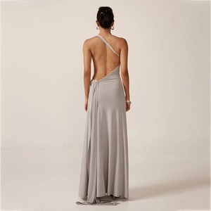 Detail of grey one-shoulder backless maxi dress showing side drape and draped fabric