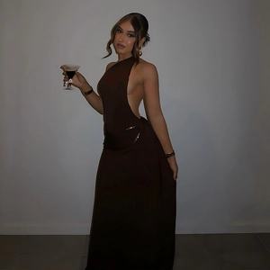 Detailed back view of a slim-fit dark brown backless evening gown with side cutouts