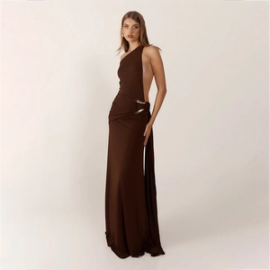 Detail of deep brown one-shoulder dress with elegant metal ring buckle and silky fabric