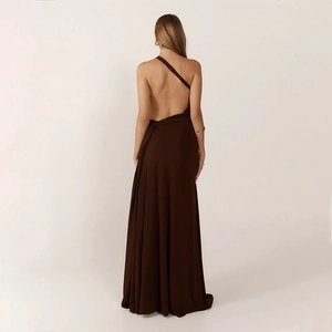 Detail of elegant backless one-shoulder floor-length dress with flowing dark brown fabric