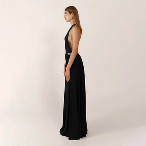 Detail view of black backless evening gown with side ruffles and gold waist buckle