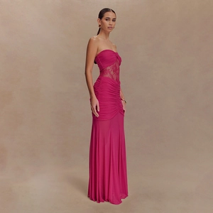 Detail of fuchsia bodycon maxi dress with lace waist patchwork and pleated mesh design