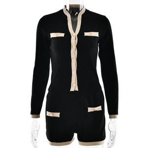 Women's two-piece knit set featuring a black cardigan with gold buttons and matching shorts